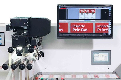 Inline inspection camera reading printed web material with results shown on a monitor