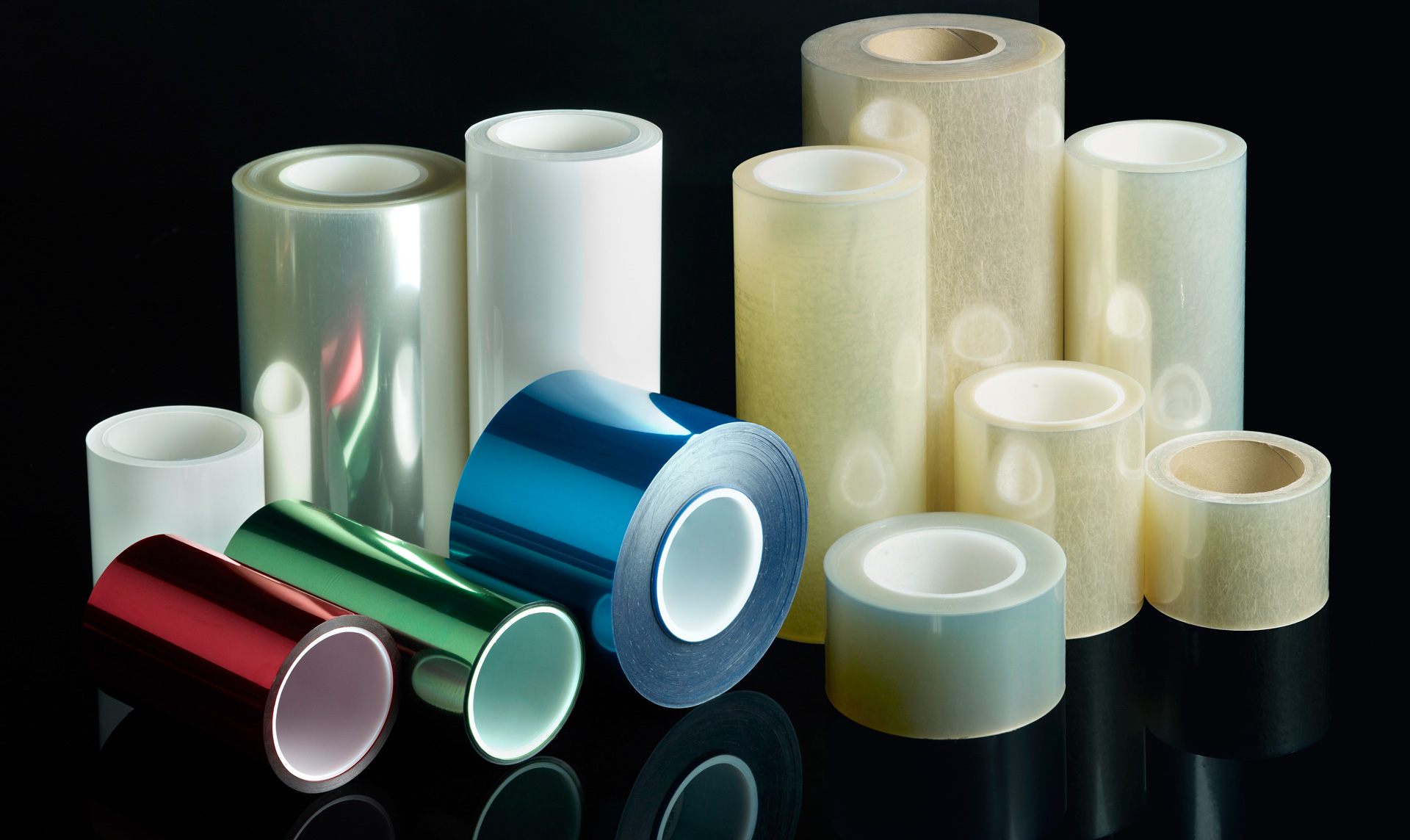 Range of process tape and release liner rolls in clear, blue, green, red and natural finishes